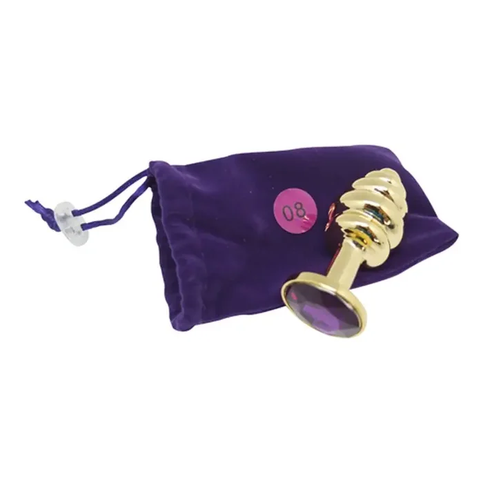 Buttplug in Gold mit Riffeln und violettem Kristall